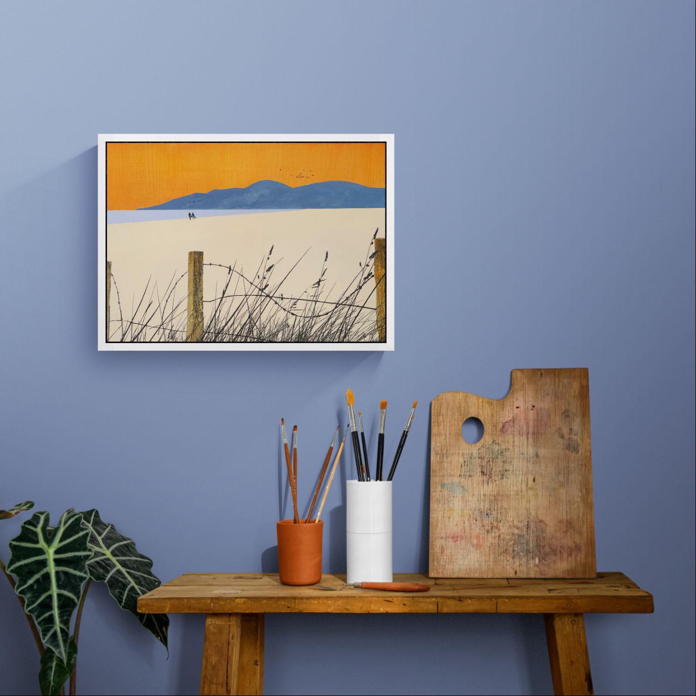 The framed 'A Shared Horizon' canvas print styled above a table, highlighting the vibrant orange and lilac hues in the evening light.