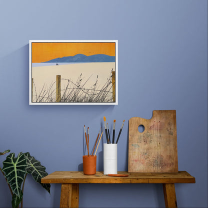 The framed 'A Shared Horizon' canvas print styled above a table, highlighting the vibrant orange and lilac hues in the evening light.